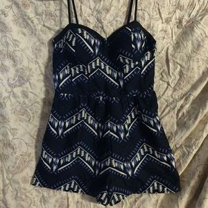 Patterned black white and blue romper with pockets